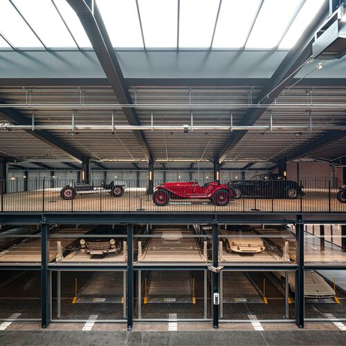 A museum with a parking system for cars and classic cars