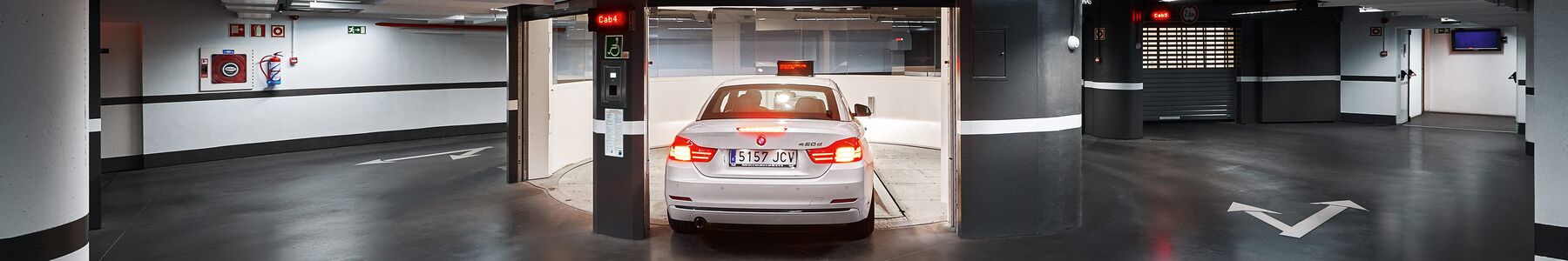 The car drives into the entrance bay of the Parksafe