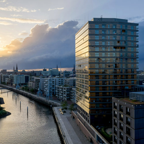 A view of the skyscraper at dusk in Hamburg’s HafenCity