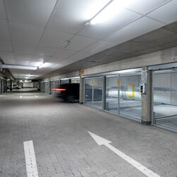 Overview of the underground car park with a car driving in