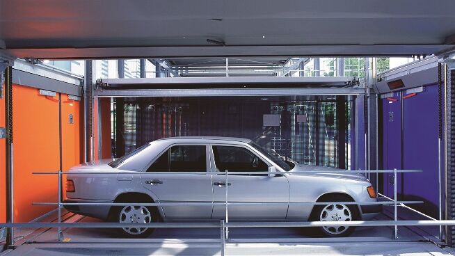 The car is waiting in the handover bay, ready to be parked