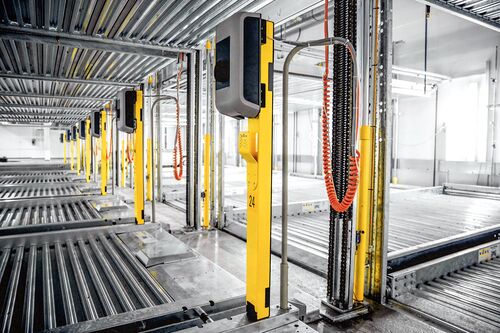 Electric charging points are located on a parking system
