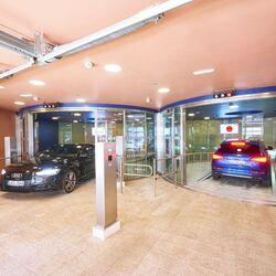 A car drives into an automated parking system